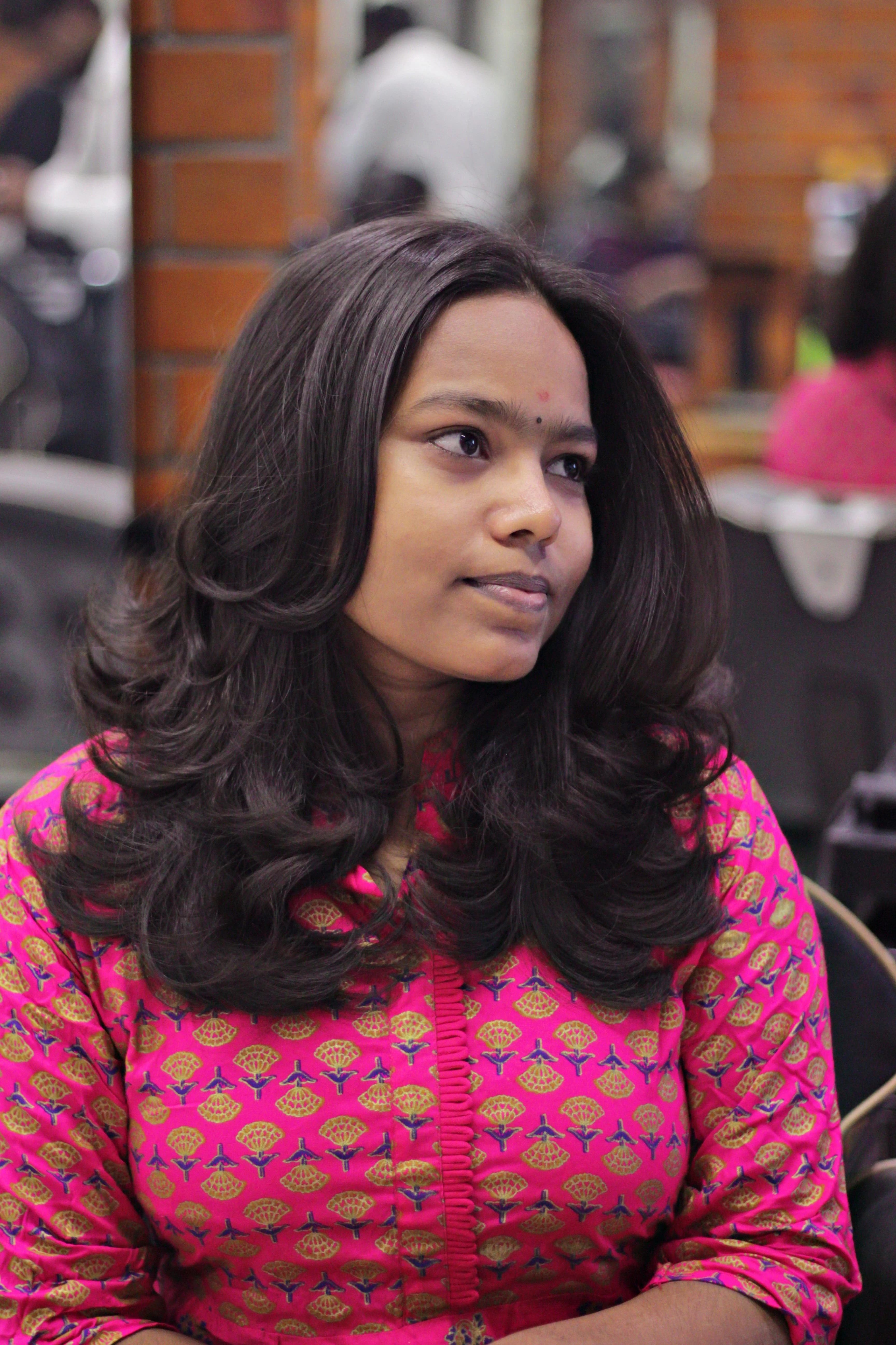 Soft bouncy blow-dry with face-framing curls