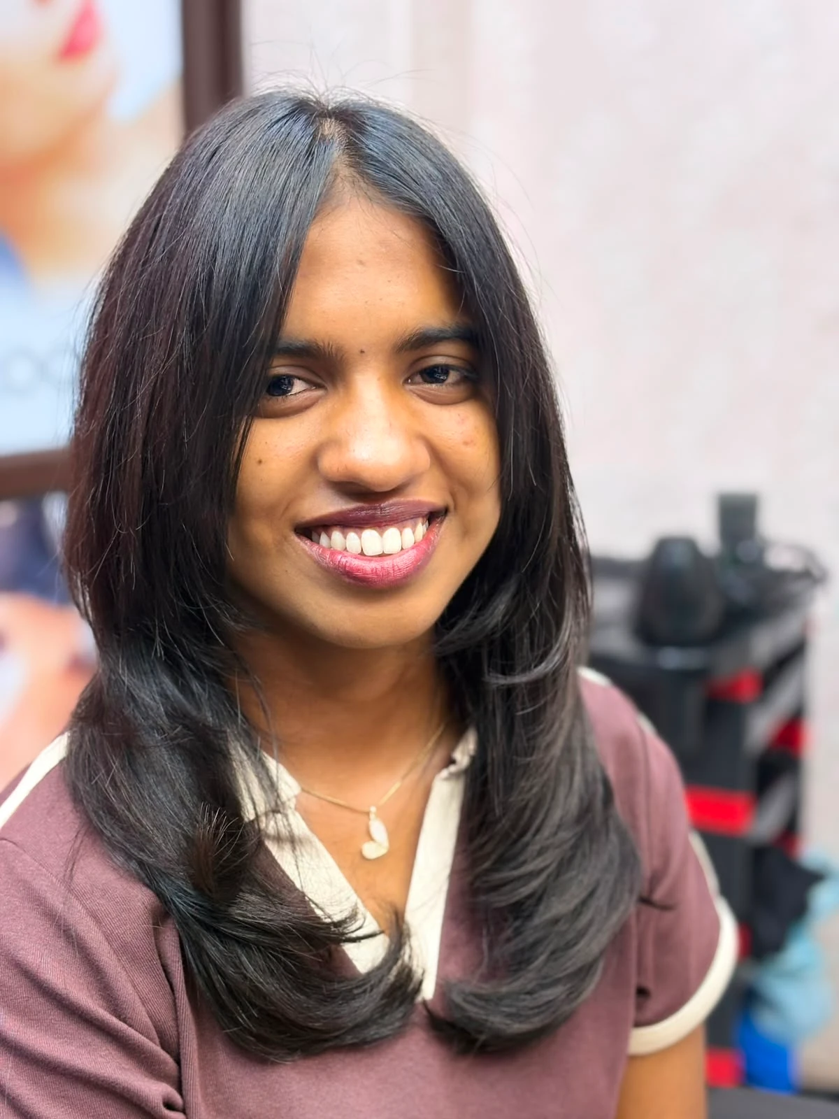Smooth layered blow-dry with side-swept fringe