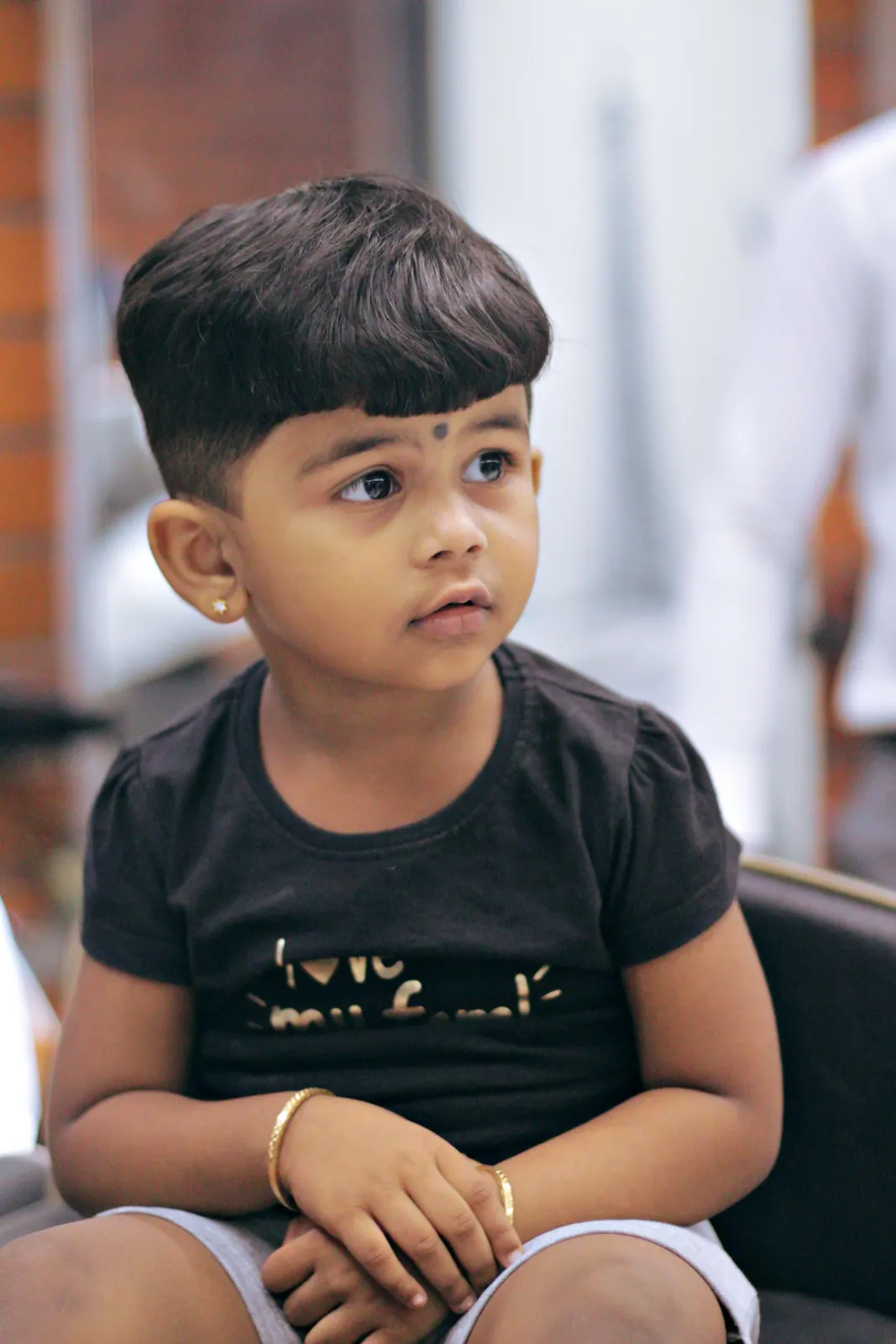 Neat kids' haircut with a soft fringe