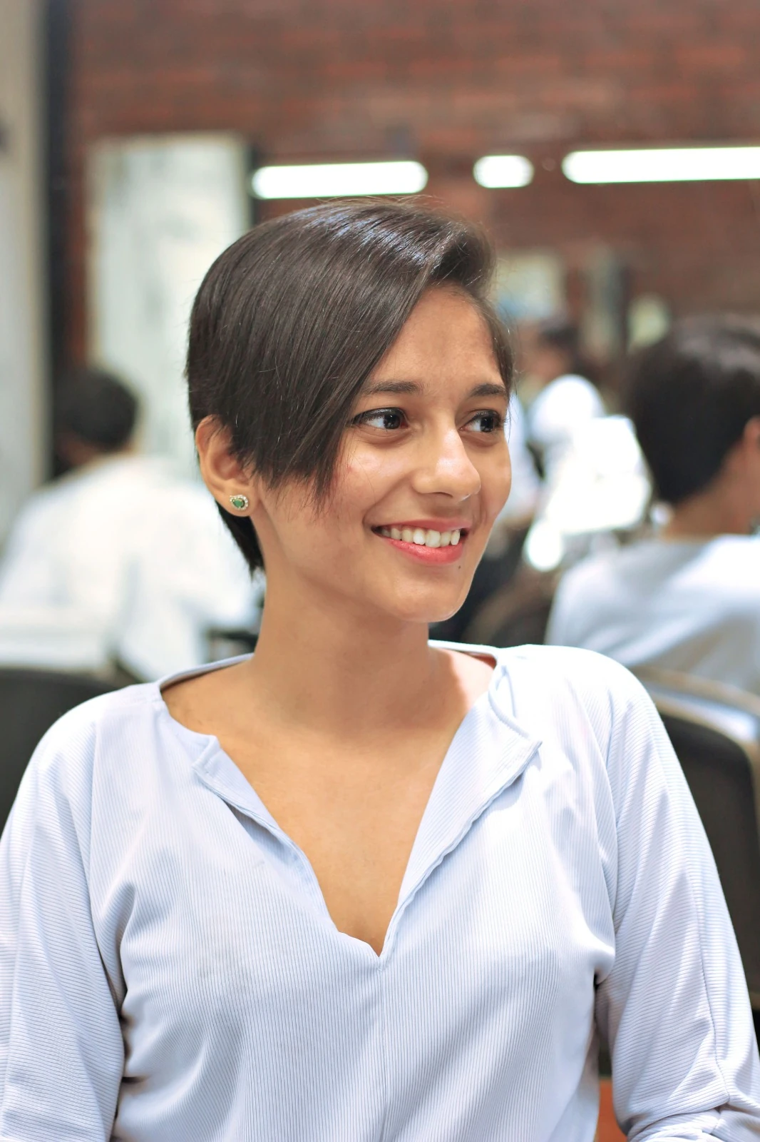 Chic short pixie cut styled to the side