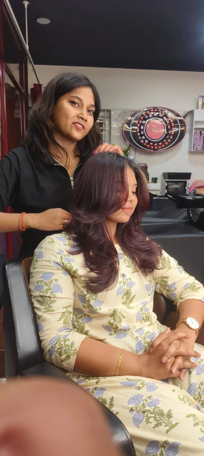 Client styled in a floral outfit