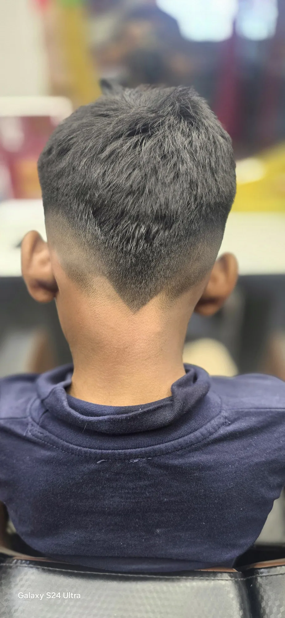 Precise men's fade haircut, back view