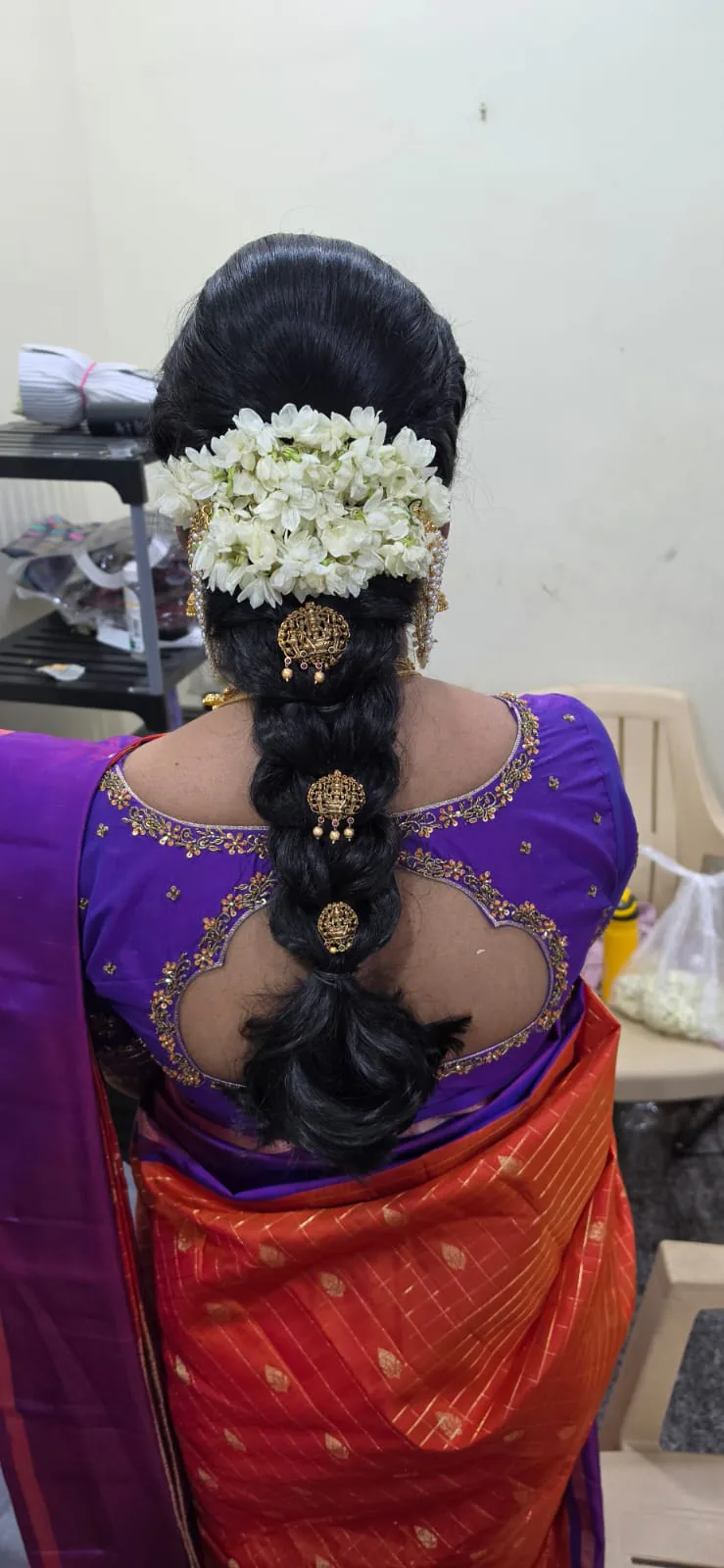 Bridal updo dressed with jasmine flowers