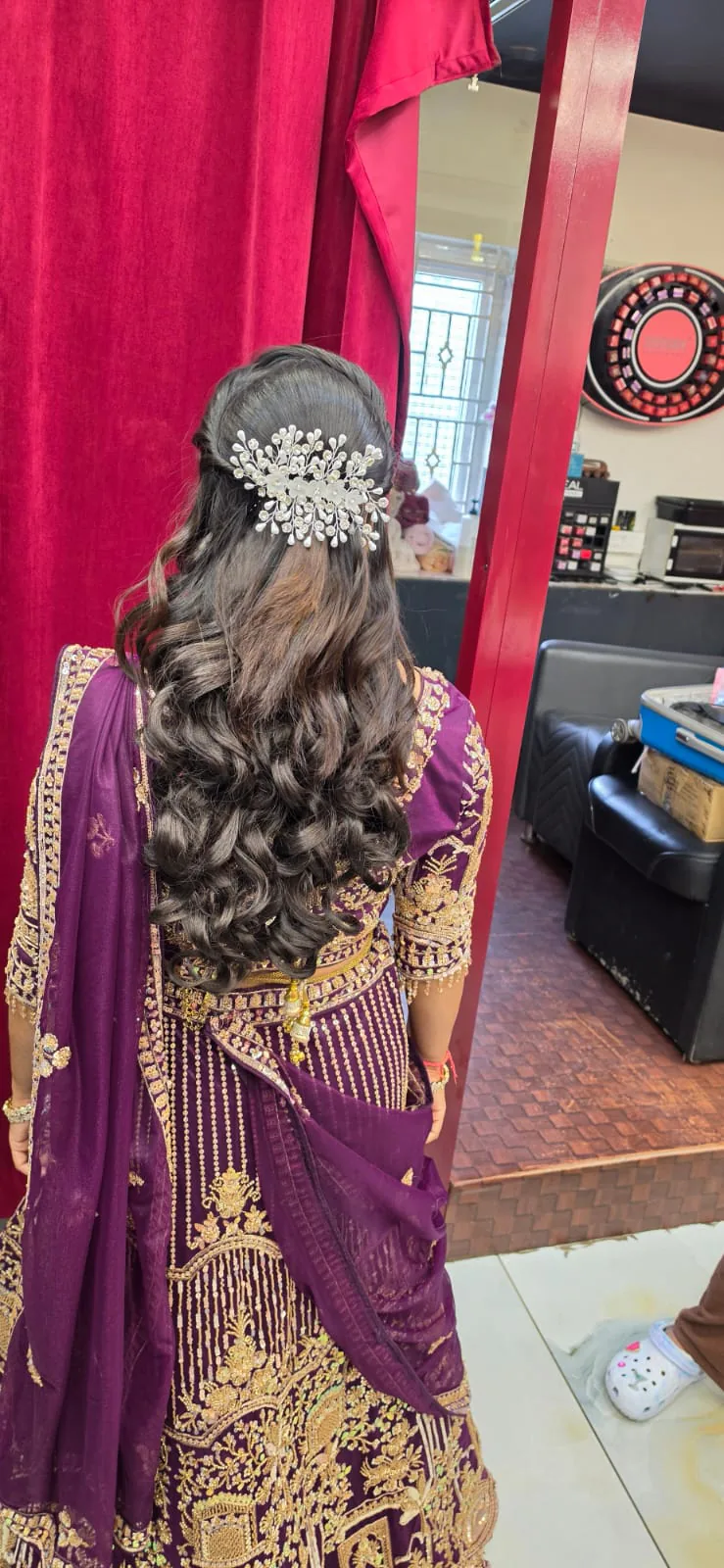 Bridal hair styled with an ornate accessory