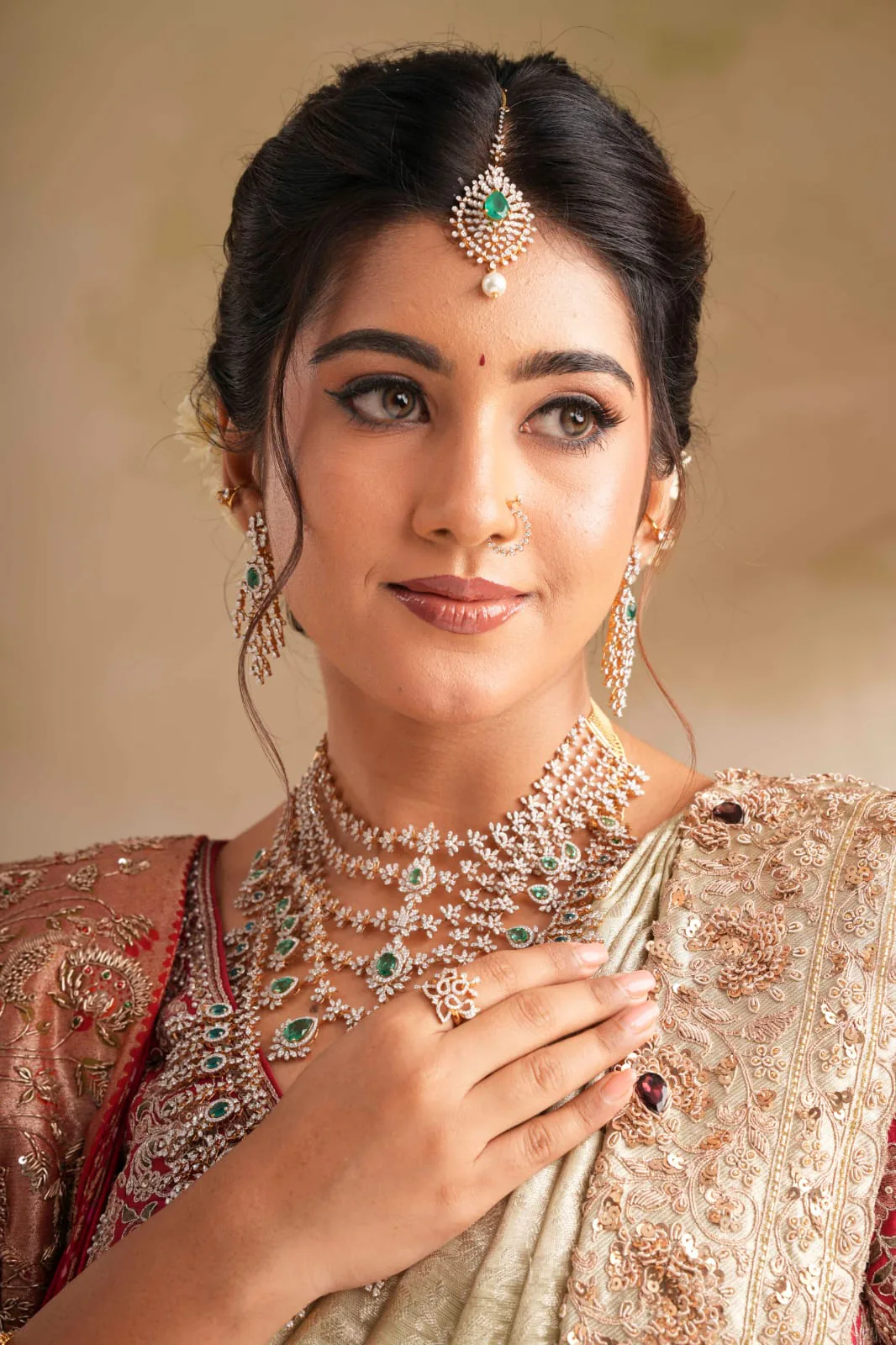 Bridal makeup with a maang tikka and statement jewellery