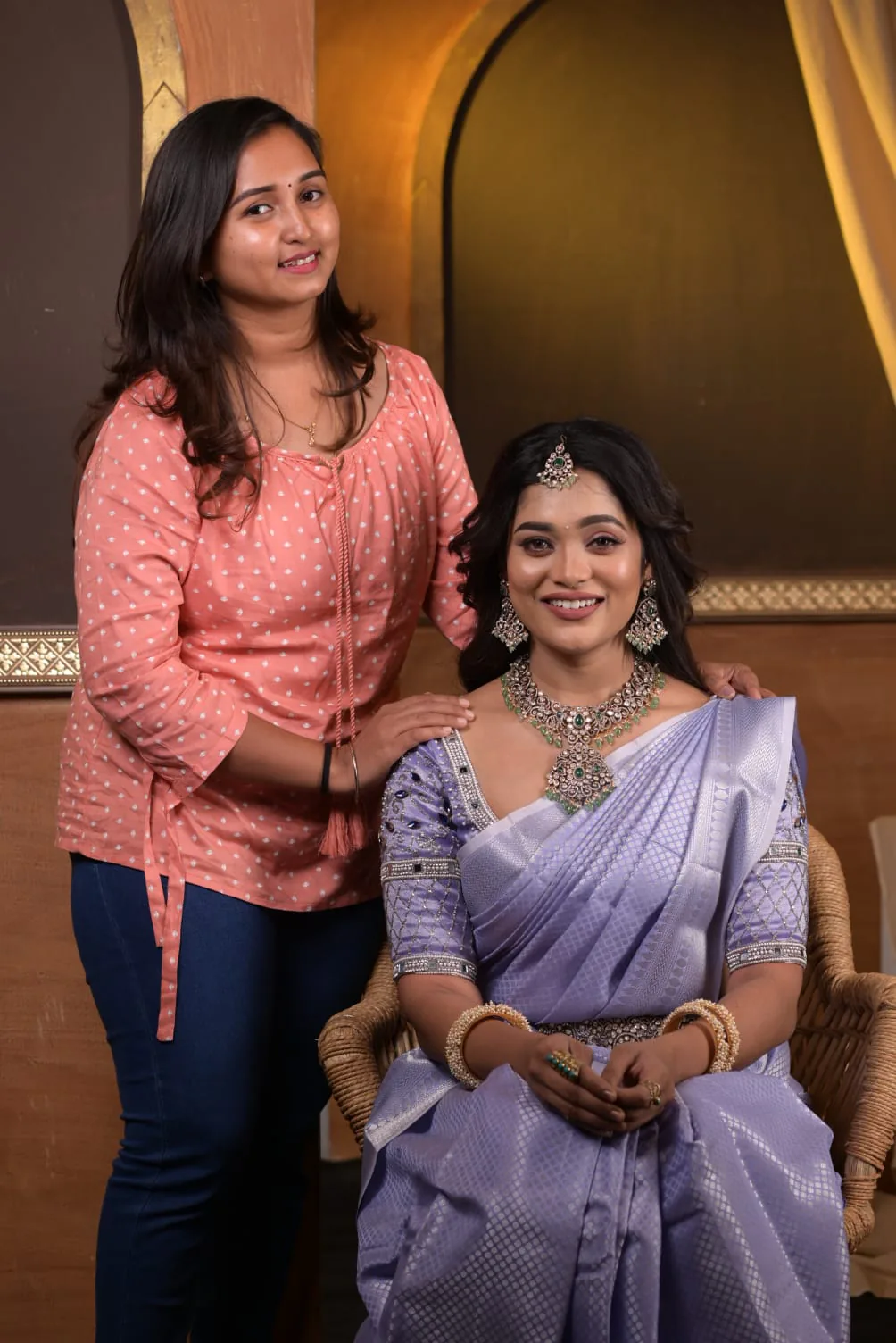 Mother and daughter styled for a celebration