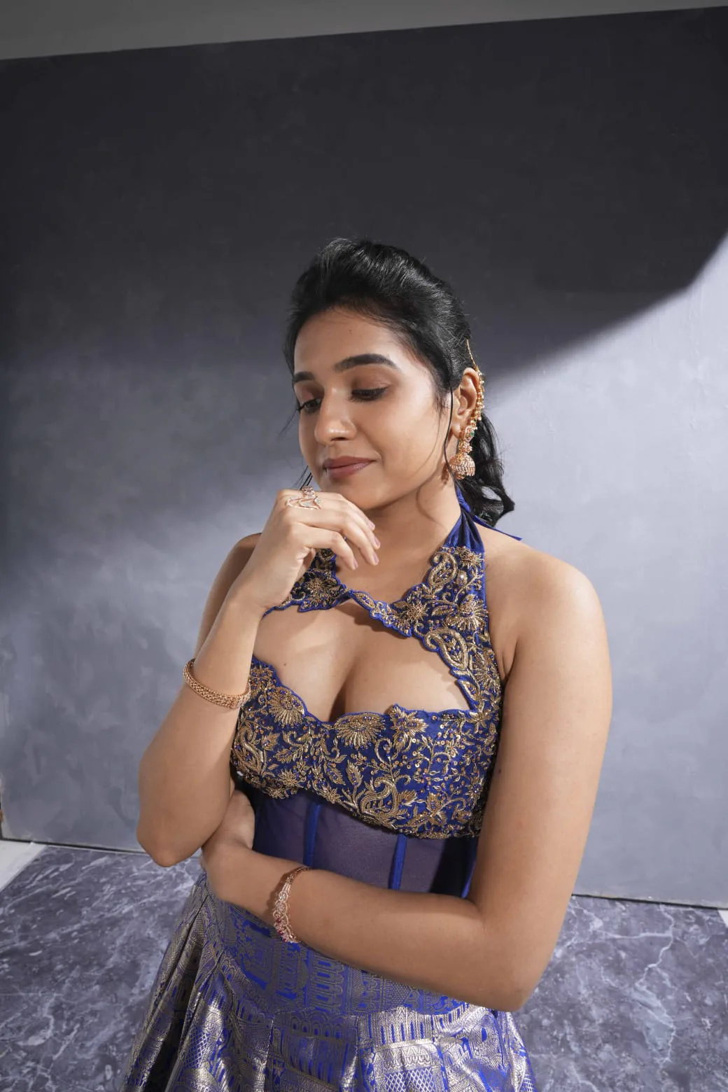 Editorial glam in a blue and gold outfit