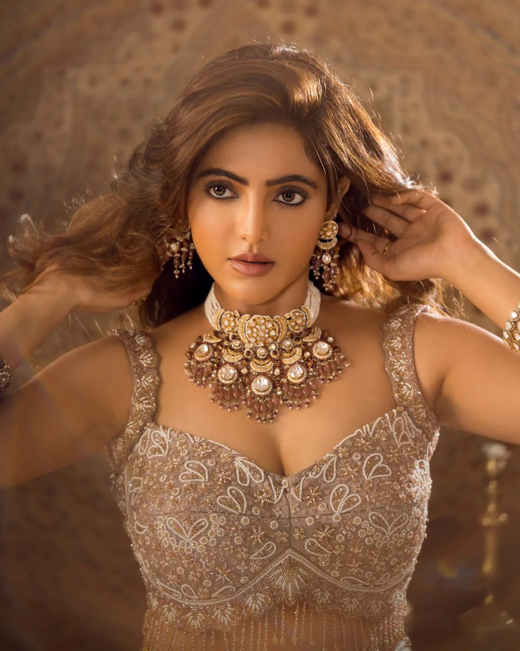 Warm-toned glam with statement jewellery