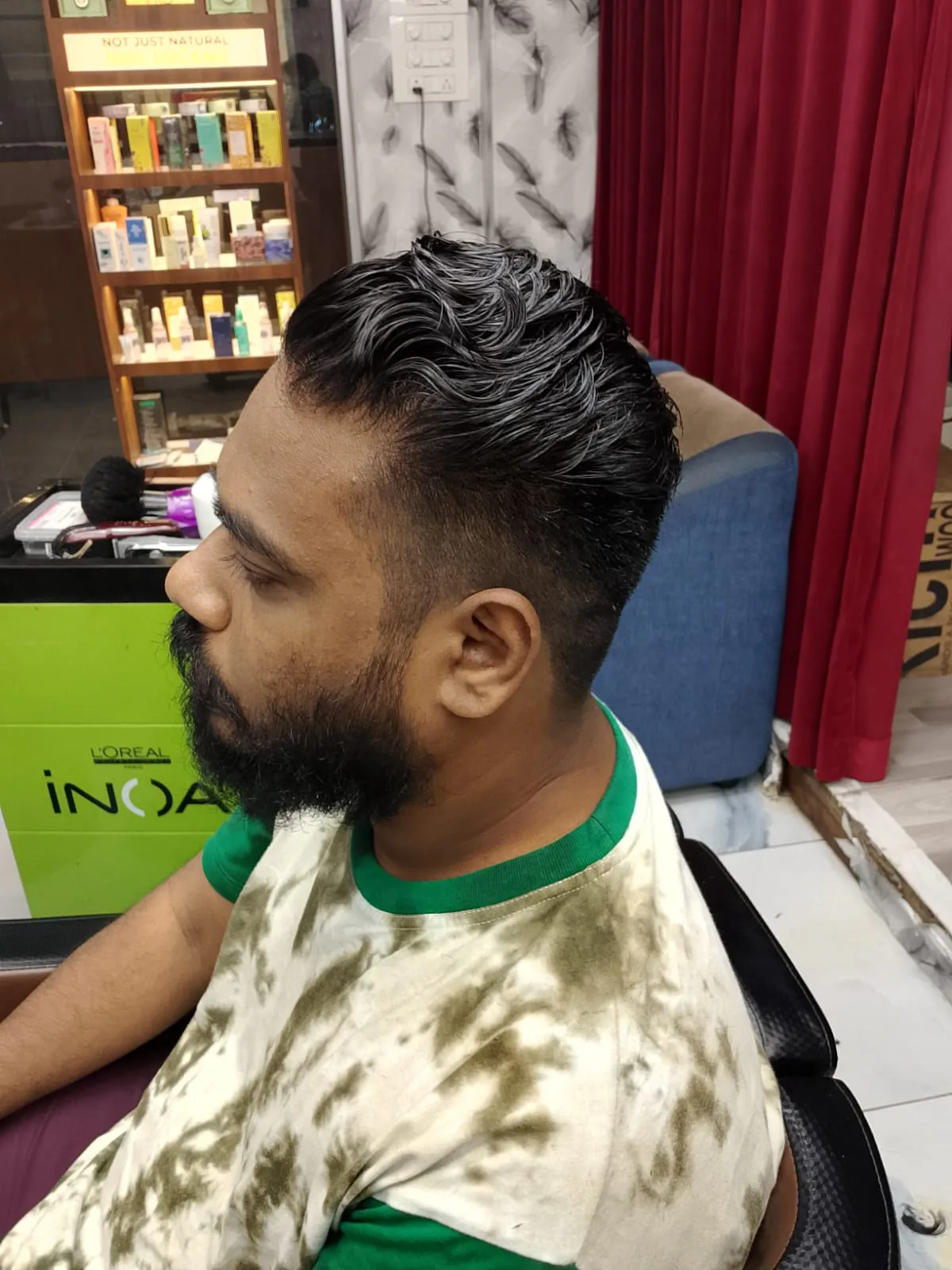 Men's haircut and styling in progress