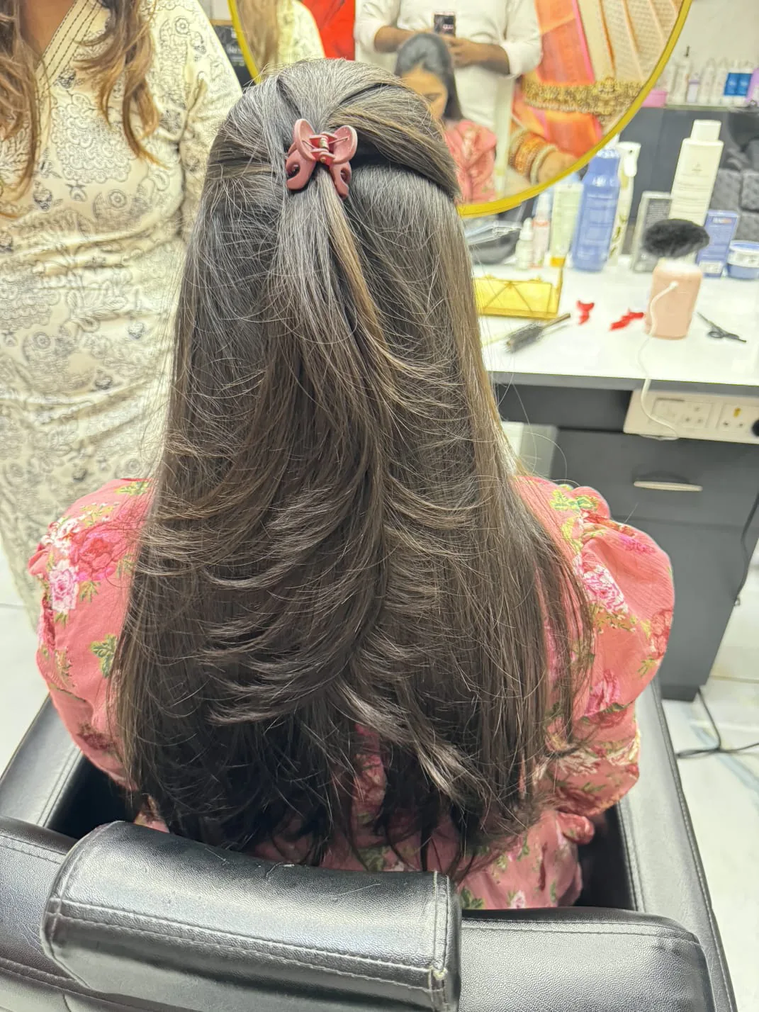 Bridal hairstyle with a long, adorned braid