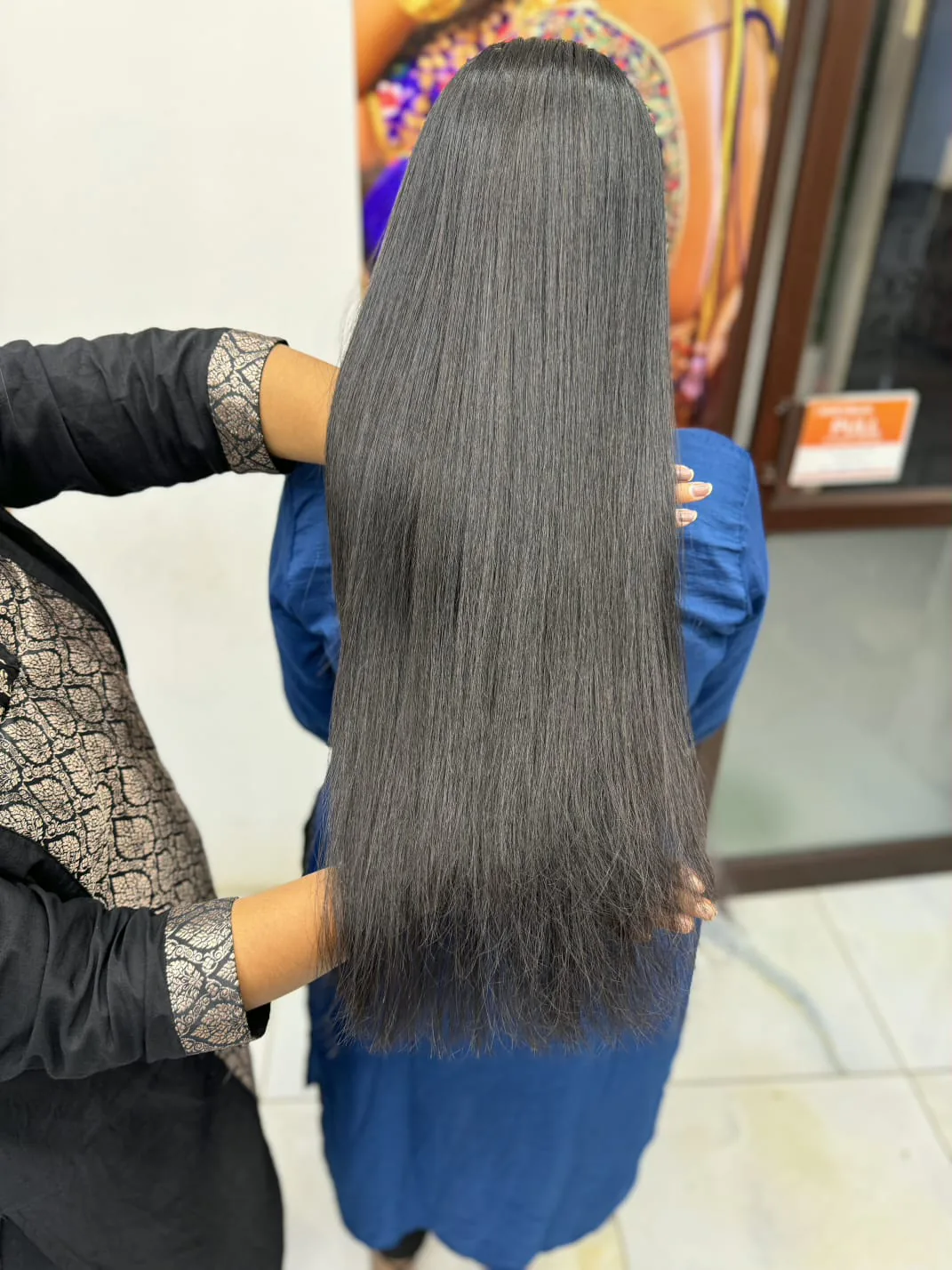 Sleek, silky long straight hair, back view
